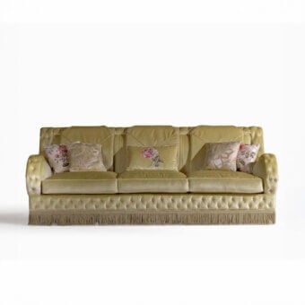 Lavish Armando Rho A1294 sofa upholstered in luminous green velvet with sculpted arms and ornate fringe detailing