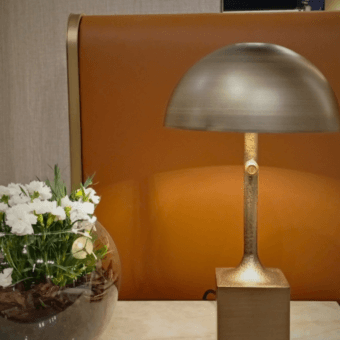 Distinguished Bellavista Wagasa table lamp crafted in brass with an Antique bronze finish and refined hammered texture