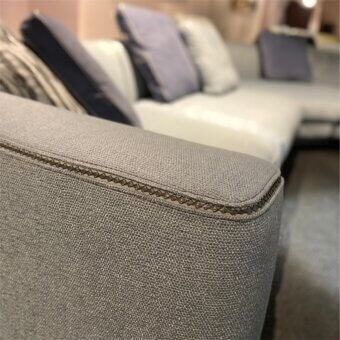 Distinguished Borzalino Franklin L sectional with textured medium gray woven fabric upholstery and elegant piping