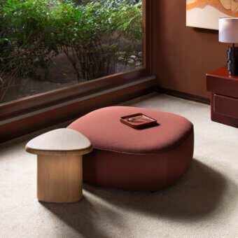 Exceptional Carpanese Home Bitt side table crafted from wood with a satin finish and visible grain