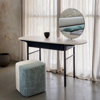 Distinguished Carpanese Home Delorean vanity with shaped matt marble surface and slender ash wood legs in dark matte finish