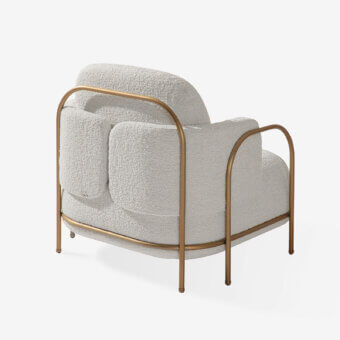 Distinctive Carpanese Home Gaston lounge chair with sculpted satin Brass metal and creamy textured bouclé upholstery crafted in Italy