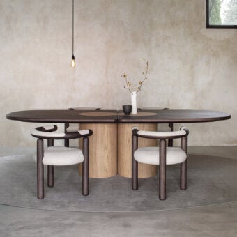 Elegant Carpanese Home Ladybug table crafted in dark matte-finished ash wood with lighter toned cylindrical supports