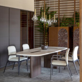 Architectural Carpanese Home Linea T table with white marble tabletop and dark ash wood perpendicularly rising legs