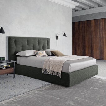Elegant Dallagnese Bars bed with a wide vertically-paneled headboard upholstered in dark green fabric and wooden inserts