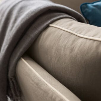 Distinguished Dallagnese Milton sofa crafted in neutral beige woven fabric with delicate white cord outlining and fringed gray textile accents