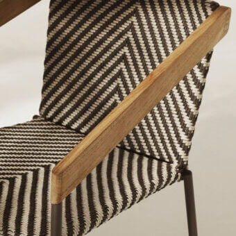 Exceptional Ethimo Allaperto Bistrò armchair with metal frame, wood armrests, and herringbone woven textile in black and creamy off-white with matte finish