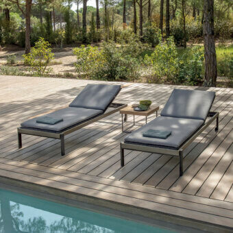 Superior Ethimo Allaperto lounger with a matte dark gray metal frame and coordinating textile surface crafted in Italy