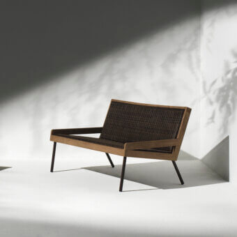 Distinguished Ethimo Allaperto two-seater sofa crafted with medium brown wood and dark woven textile, featuring sleek matte metal legs