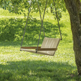 Distinguished Ethimo Allaperto Swing chair with woven textile and warm medium-brown wooden frame with satin finish