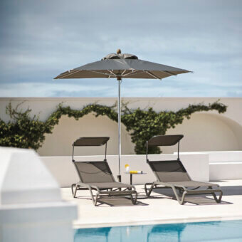 Distinguished Ethimo Free Umbrella parasol in neutral gray matte textile with sleek silver-toned metal frame