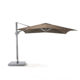 Elegant Ethimo Freedom umbrella crafted in neutral beige with a satin metal frame offering adjustable coverage