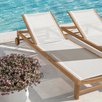 Exceptional Ethimo Sand lounger crafted in Italy with warm brown wood and bright white textile construction