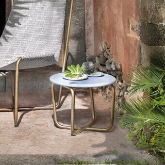 Exceptional Ethimo Sling Side Table crafted in Italy with a sleek pale blue tabletop and intertwined golden-toned metal base with a matte finish
