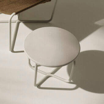 Superior Ethimo Sling Side Table crafted in Italy with a sleek circular form and matte neutral beige coloration
