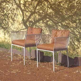 Distinguished Ethimo Venexia armchair crafted in Italy with a refined aluminum frame and reddish-brown cushions offering a contemporary finish