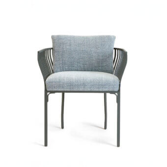 Elegant Ethimo Venexia armchair in muted blue-gray textile with a refined aluminum frame and gently curved metal armrests