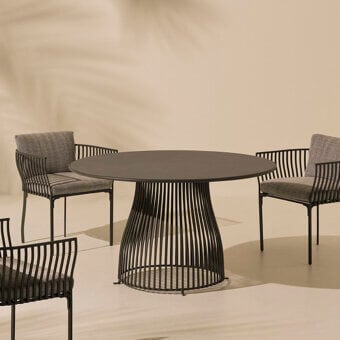Superior Ethimo Venexia table crafted in Italy with dark gray aluminum and durable enamelled lava stone