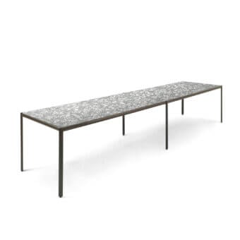 Elegant Giorgetti Aldìa table built with dark matte metal legs and a speckled gray terrazzo-like composite surface