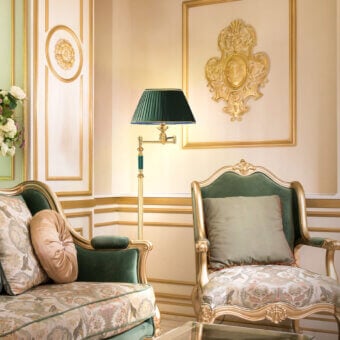 Distinguished Laudarte Angelo floor lamp crafted in bronze with 24K ancient gold plating and a deep green textile lampshade