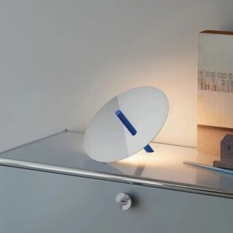 Architectural Luceplan Millimetro table lamp in cool gray satin aluminum with a striking dark blue stripe across its reflective disc