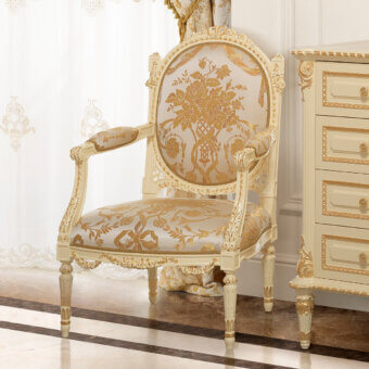 Lavish Modenese Golden Radiance lounge chair with ivory wood frame and gold-leaf embellishments upholstered in floral textile
