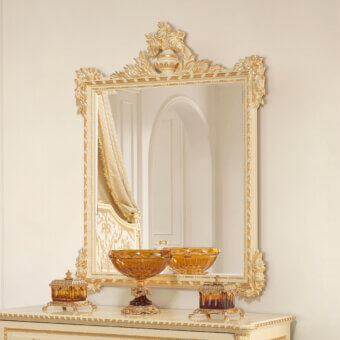 Lavish Modenese Golden Radiance mirror crafted in Italy with a wood frame and glossy golden finish exhibiting ornate floral motifs