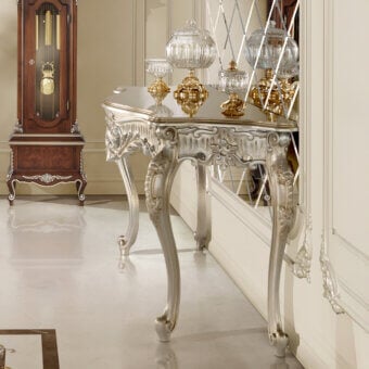 Distinguished Modenese Luxury Furniture Noble Etiquette console in silver leaf with floral motifs and curved cabriole legs
