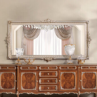Distinguished Modenese Noble Etiquette mirror crafted in silver-toned gloss wood with intricate floral and foliate carvings