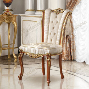 Distinguished Modenese Royal Blend chair with creamy off-white pleated upholstery and reddish-brown wood with gold leaf detailing