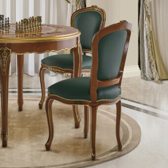 Distinguished Modenese Royal Blend chair with deep green leather upholstery and ornate golden detailing in a rich walnut finish