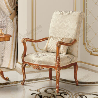 Lavish Modenese Royal Blend Walnut lounge chair with ivory fabric upholstery and glossy gold detailing
