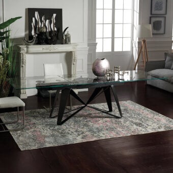 Innovative Naos Flocon extendable dining table with painted steel legs and striking glass tabletop in muted gray and blush pink tones