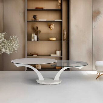 Elegant Naos Foli coffee table with unique extensible structure and synchronized revolving glass tops finished with painted coatings