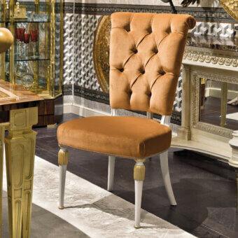 Distinguished Provasi 1604 chair with golden-brown textile upholstery and satin-finished wood built with gilded accents