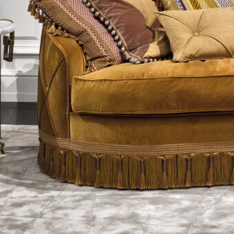 Lavish Provasi Goran sofa with plush golden yellow velvet upholstery, beaded detailing, and delicate fringe trim