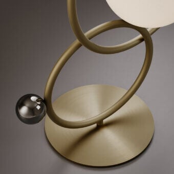 Distinguished VENICEM Zoe table lamp with intersecting light burnished brass rings and Murano blown glass diffuser in black nickel accents