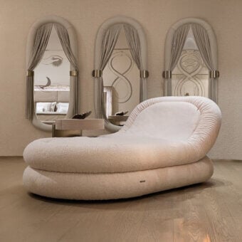 Avant-garde Visionnaire Fedro chaise lounge upholstered in plush pale beige textile with a curved profile