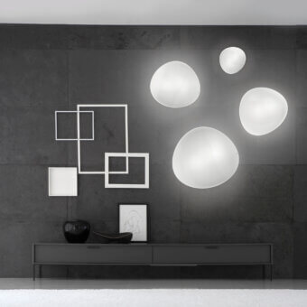Exceptional Vistosi Balance wall lamp crafted in hand-blown glass with a smooth matte finish and elliptical shape