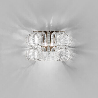 Superior Vistosi Ecos wall lamp crafted in ridged transparent glass and metal with a glossy finish