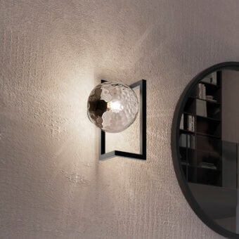 Exclusive Vistosi Globose wall lamp crafted in matte black metal with hand-blown glass diffuser for a captivating glow