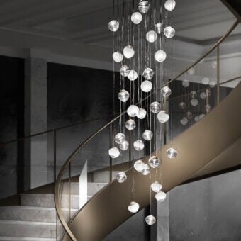 Distinguished Vistosi Pure suspension lamp crafted in clear glass with a silver-toned metal structure and elongated curved form