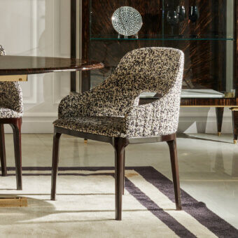 Avant-garde Zanaboni Addison armchair handcrafted with black and white patterned textile and walnut-stained ash wood base