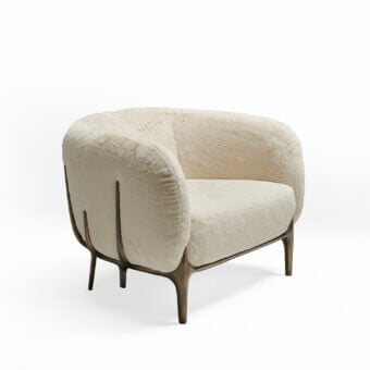 Lavish Zanaboni Blanca lounge chair with black-stained ash wood structure and off-white bouclé upholstery