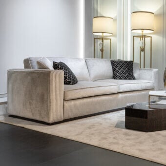 Meticulous Zanaboni Brera sofa crafted in light grey textile with embroidered vertical bands and semi-gloss ebony finish