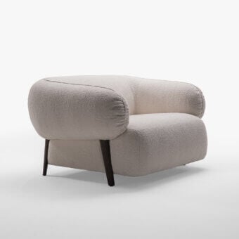 Exceptional Zanaboni Carol lounge chair crafted with textured bouclé weave in a creamy beige hue and a sturdy wood structure