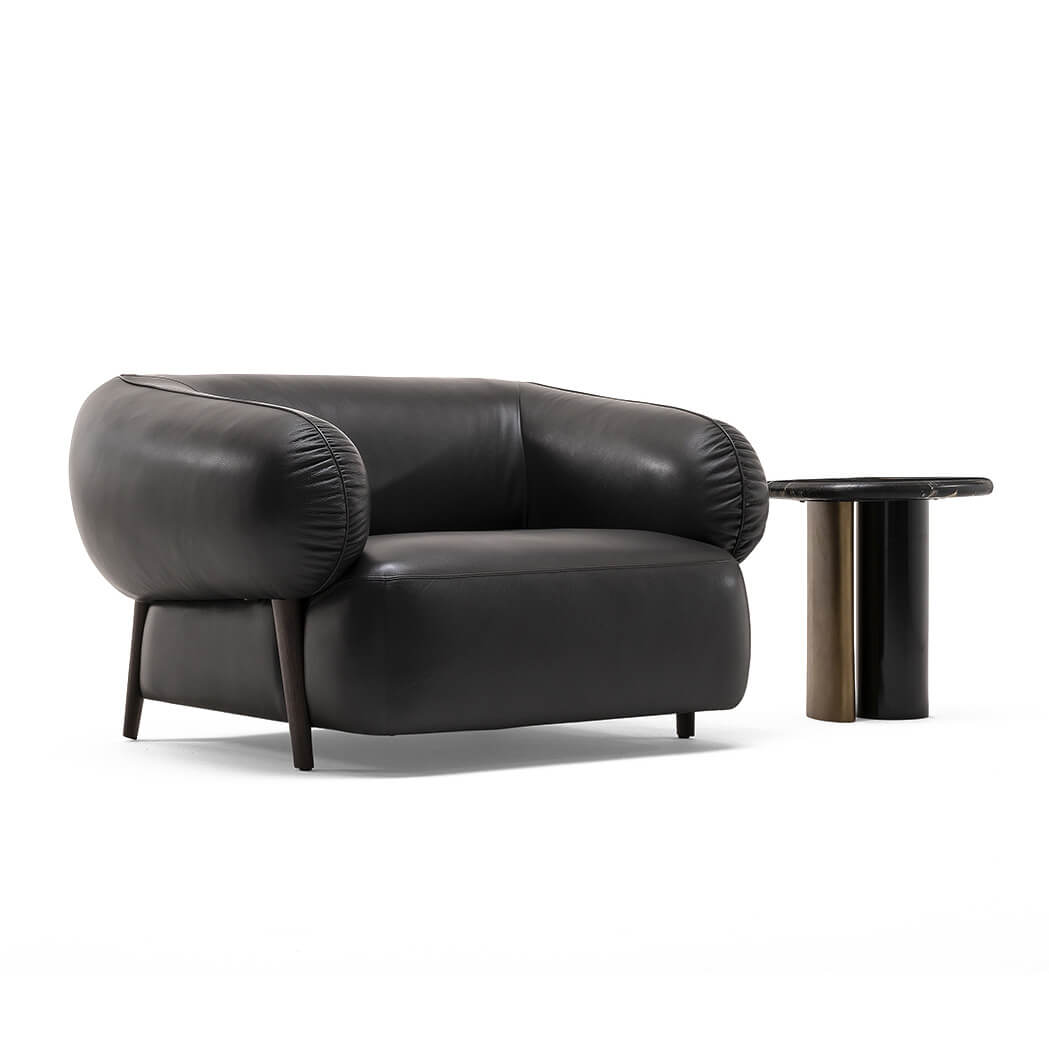 Superior Zanaboni Carol lounge chair with dark-toned leather upholstery and a sturdy wood base built with organic form