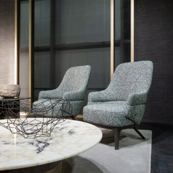 Exceptional Zanaboni Kore lounge chair with textured muted gray textile upholstery and satin-finish tapered wooden legs