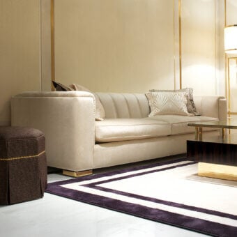 Distinguished Zanaboni Magritte sofa with enveloping silhouette and luxurious channeled velvet upholstery, built with gold-finish metal feet