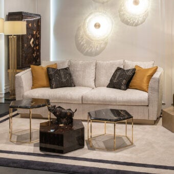 Elegant Zanaboni Morgana sofa with light neutral beige tactile fabric upholstery and satin brass recessed base